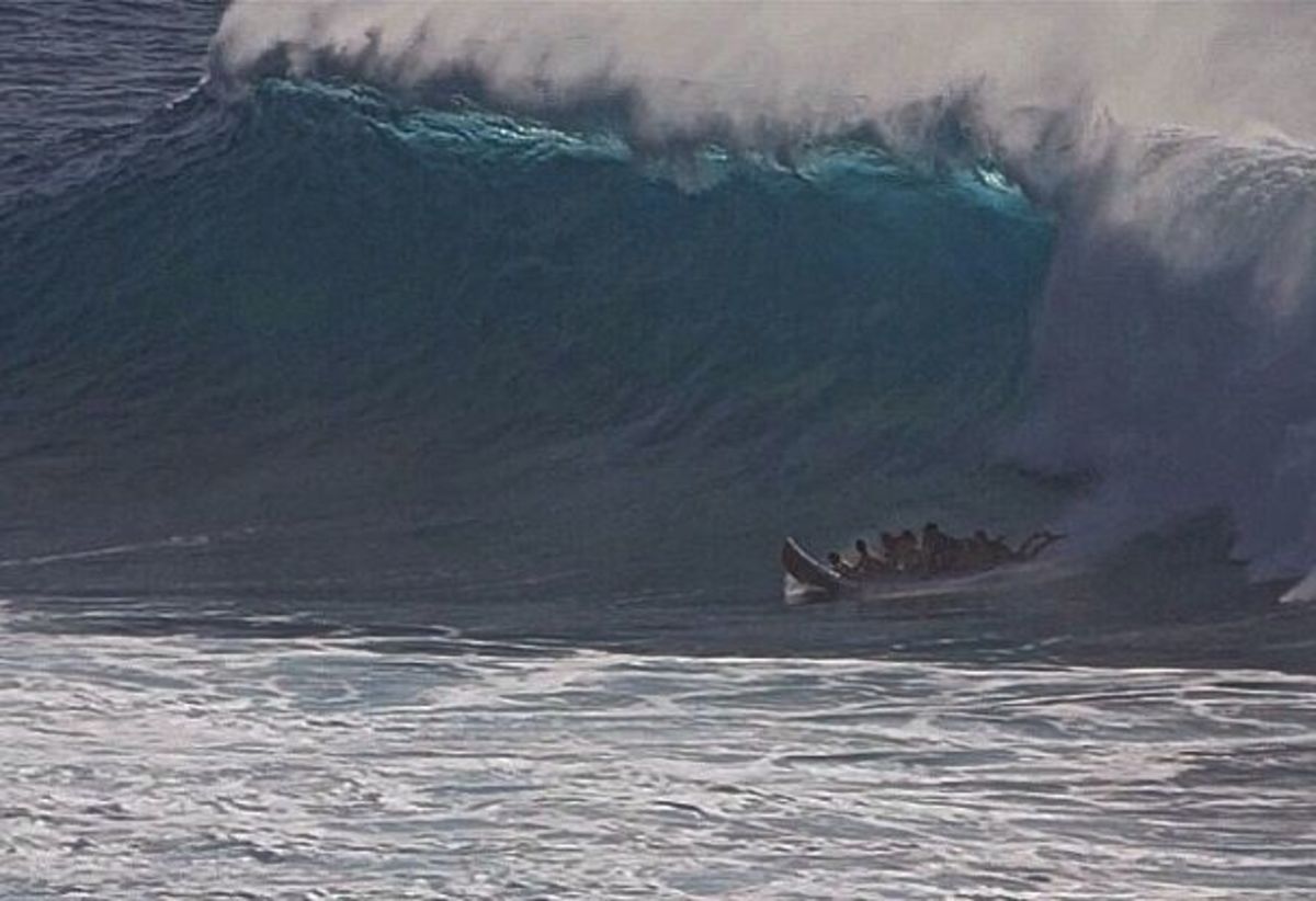 Seven surfers catch a 17-foot wave in Makaha, Hawaii, on a Supsquatch. Photo is a screen grab from the video