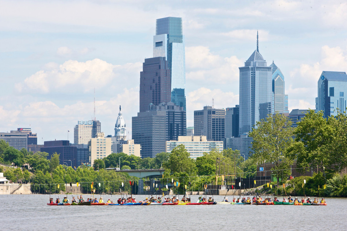 Schuylkill River Sojourn. Paddlers finishing their journey in downtown Philadelphia.