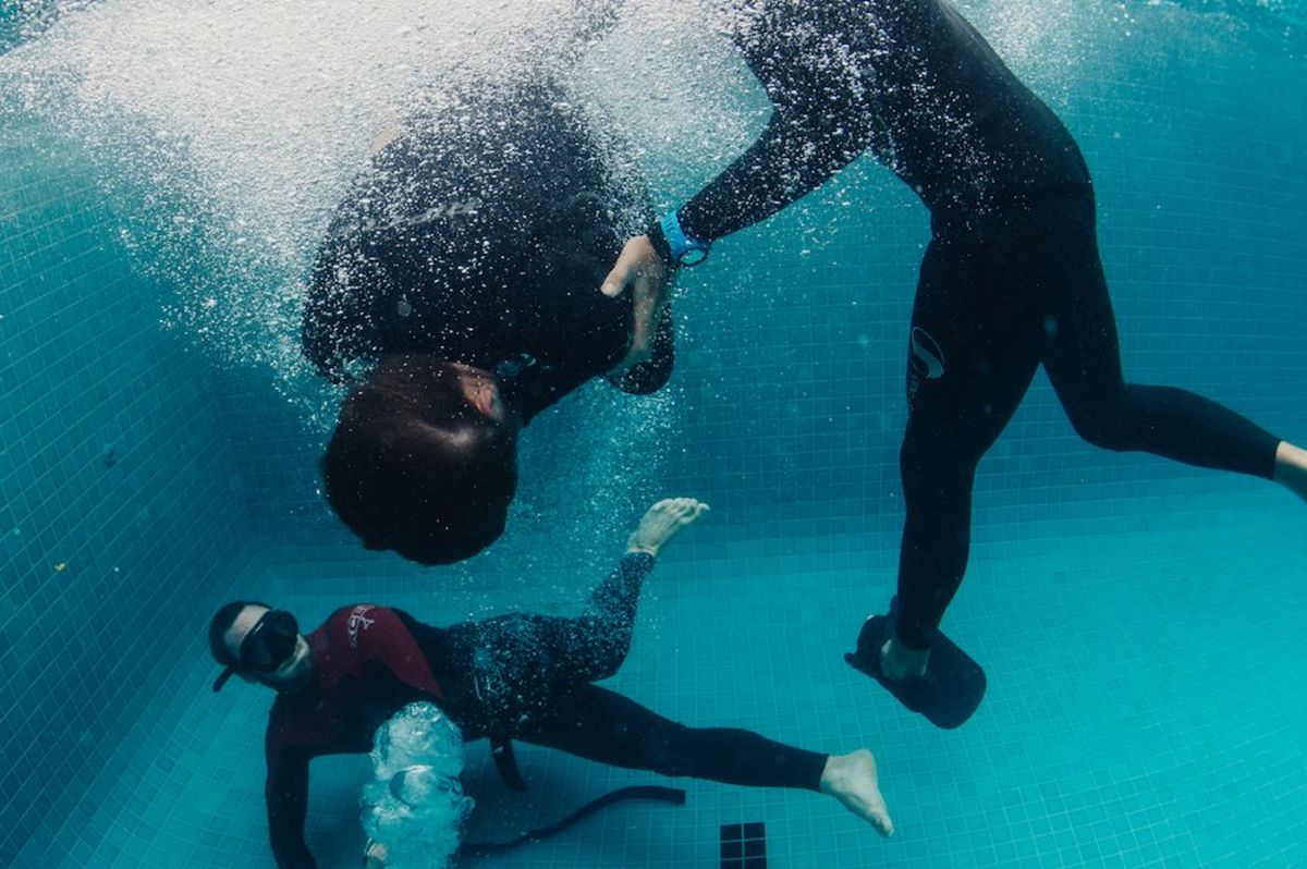Joe puts some students through an underwater drill. Photo by Russell Ord