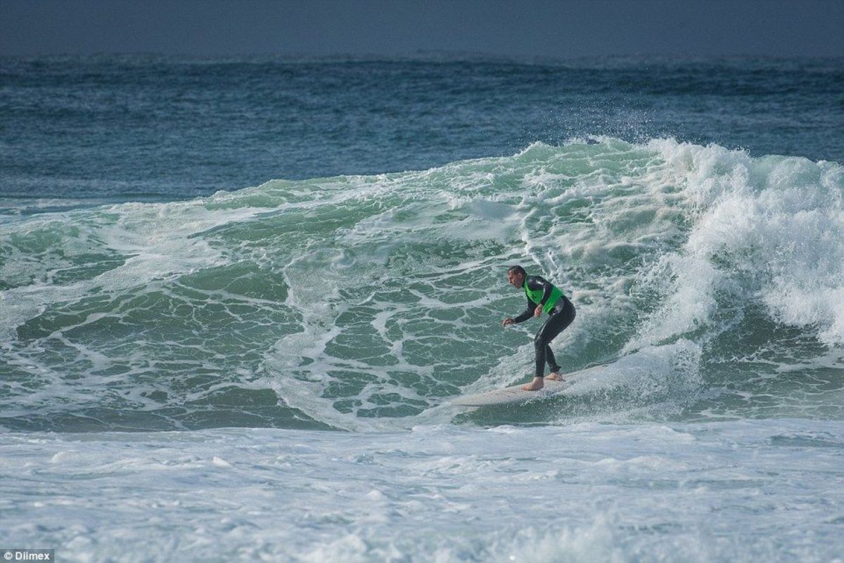 Tony Abbott on a large wave at Manly. Photo by Wipeout Dimentia