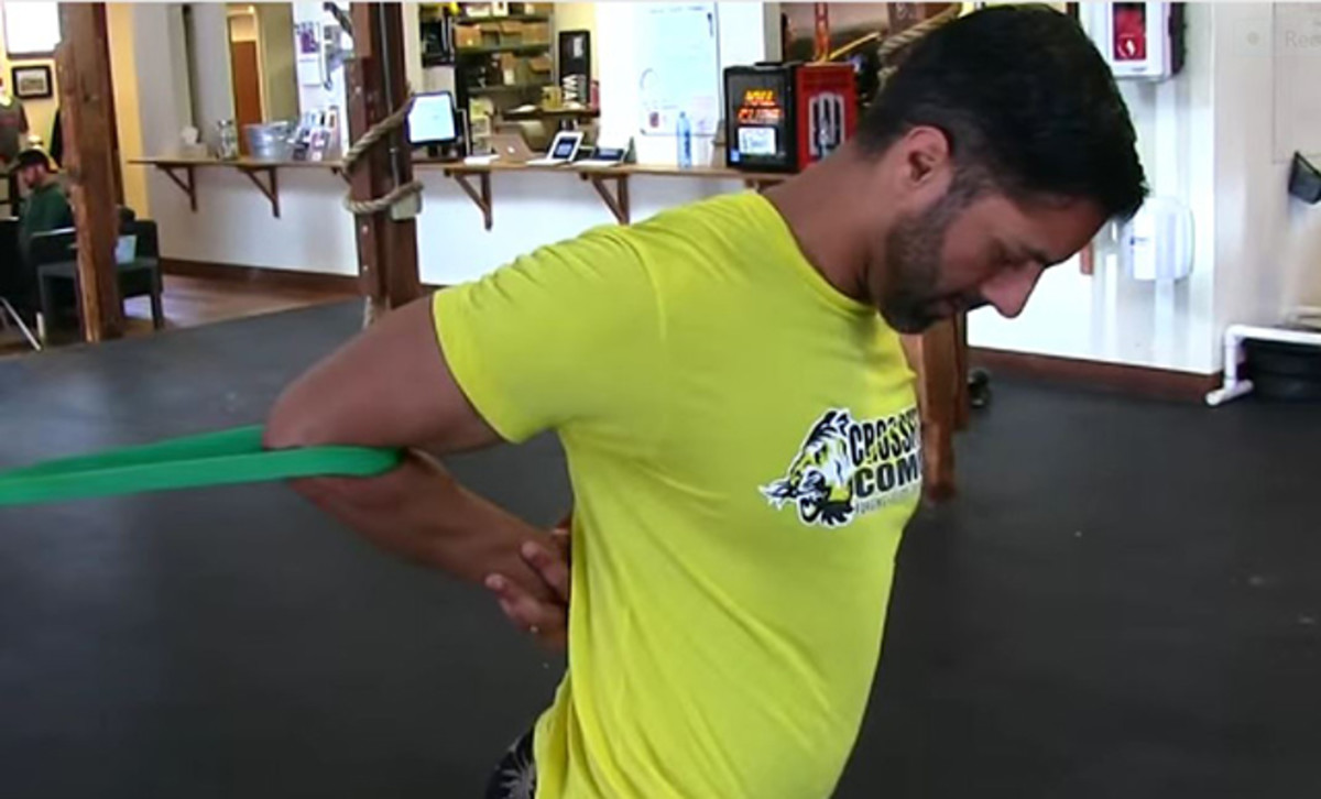 Liberating the lats is among the most critical components of the post-paddle warm-down. Photo: MobilityWOD