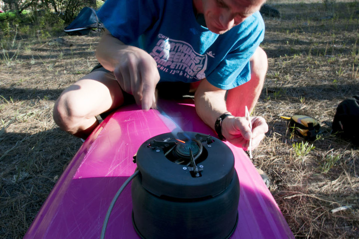 Heating a large metal spoon.