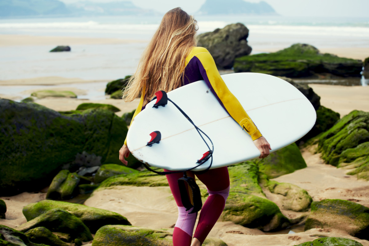 Ok, our arms may be shorter, but we can still carry our own boards. Photo: Shutterstock.com.