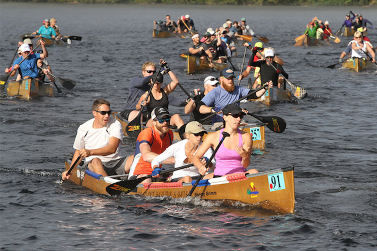 Paddlers race on Fish Creek Pond during the final day of the 90-Miler, which ends in Saranac Lake.