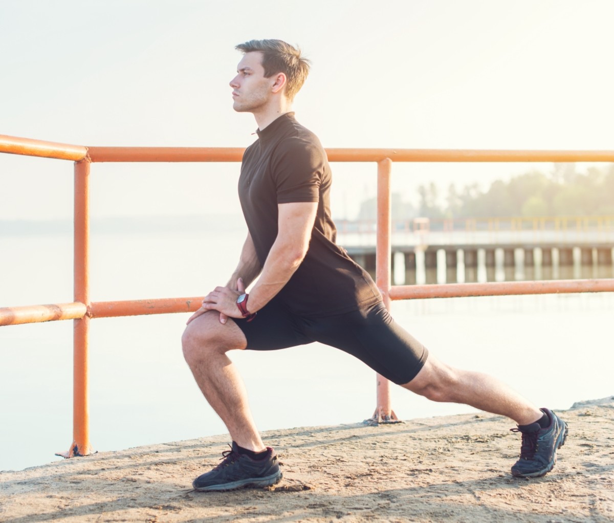 Man stretching while bending his knee. running benefits