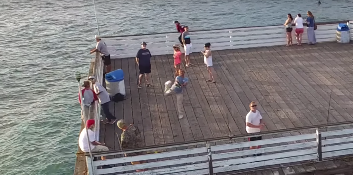 Fisherman drone Pacific Beach Crystal Pier San Diego line hook drone