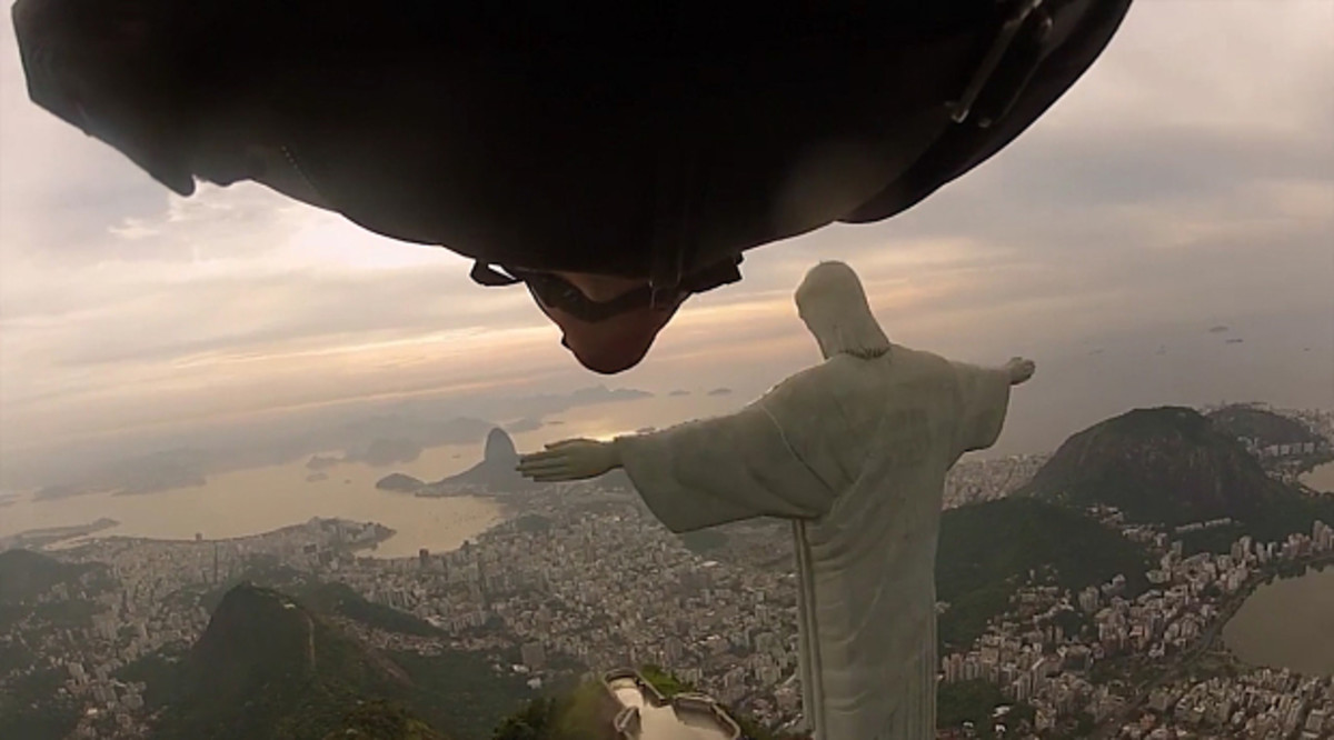 Tempting fate? A homage to a higher power? Badass? Combo of all three? A proximity flight in Rio de Janiero, underneath the arm of the Christ the Redeemer statue. Photo: Wingmen.  