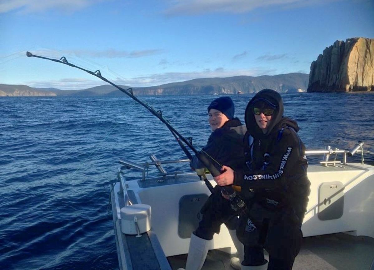 Sam and Toby Nichols battle world-record southern bluefin tuna. Photo: Personalised Sea Charters