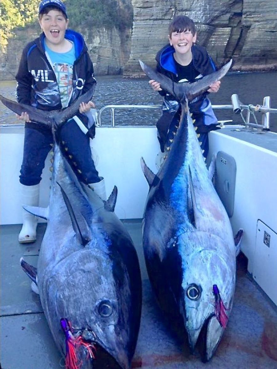 Sam Nichols, 12, (at left) and Toby Nichols, 10, simultaneously hooked and eventually landed world-record southern bluefin tuna in their respective age divisions. Photo: Personalised Sea Charters