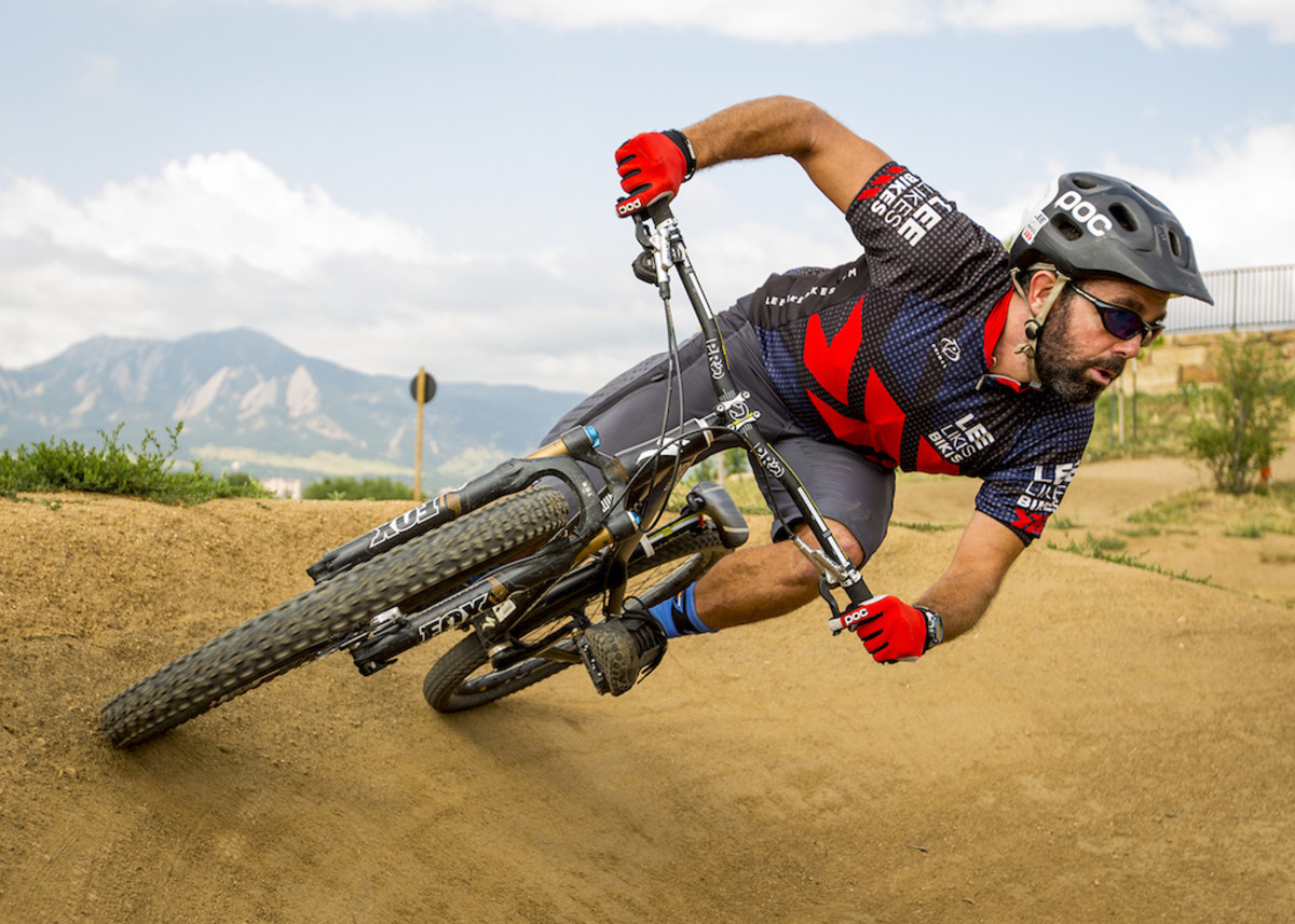 Mountain bike instructor Lee McCormack demonstrates a cornering move that initiates from the slow hip hinge movement he teaches and preaches to all riders. Photo: Leslie Kehmeier