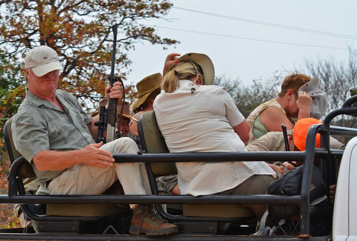 Hunters being transported to the driven hunt hide their faces. Photo: Wild Heart Wildlife Foundation