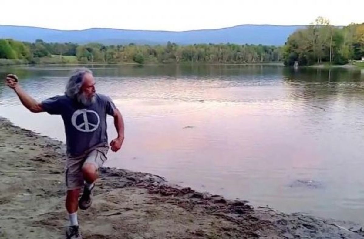 Stone skipper Kurt Steiners winds up before skipping a rock across Lake Paran in Vermont. Photo: Screen grab