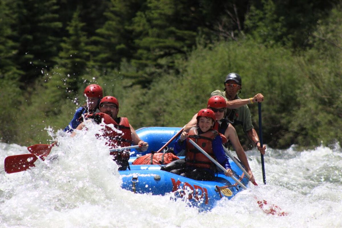 Rafting on the Blue River through Silverthorne, Colorado. Photo of the author and his family courtesy KODI Whitewater Rafting.