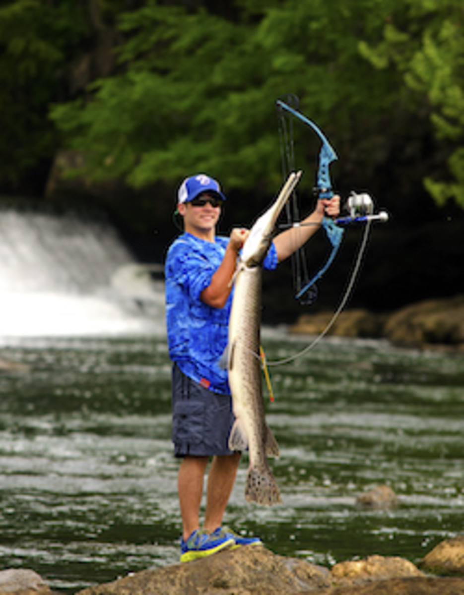 Ethan posing with his big gar. Photo by Chris Funk.