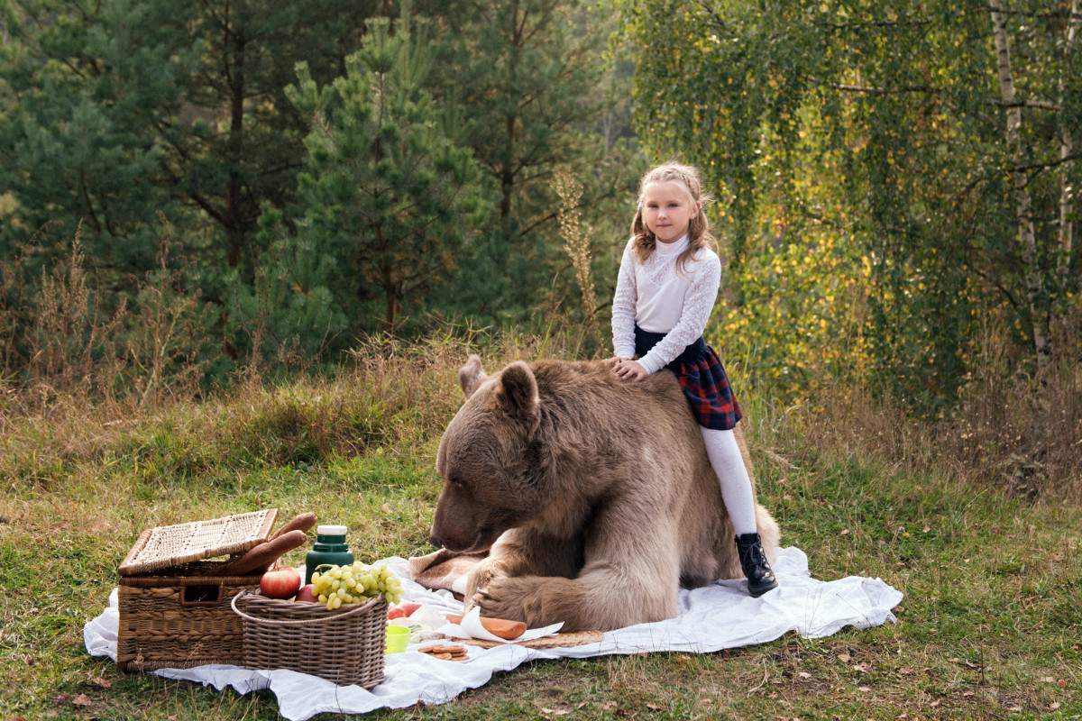 Katya was hesitant around the grizzly bear at first but quickly warmed up to it.
