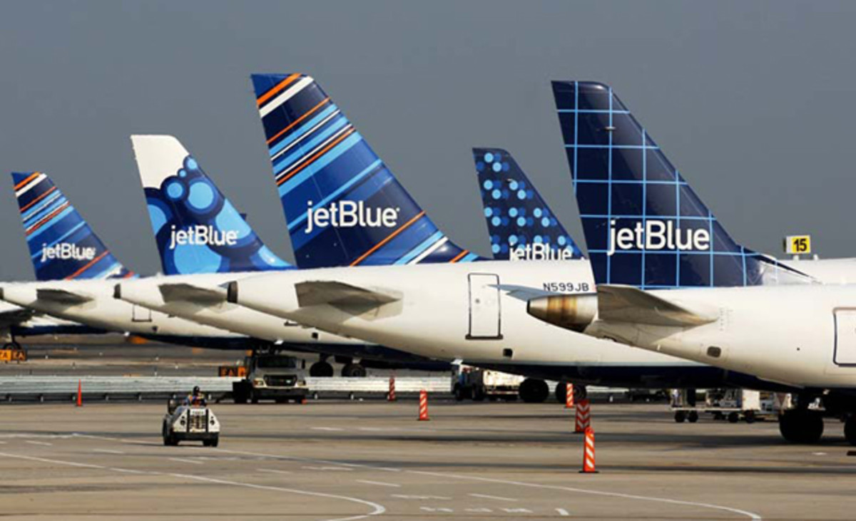 Jet Blue charges $50 per surfboard one way and states that the board's condition upon arrival is risk assumed by the customer. 