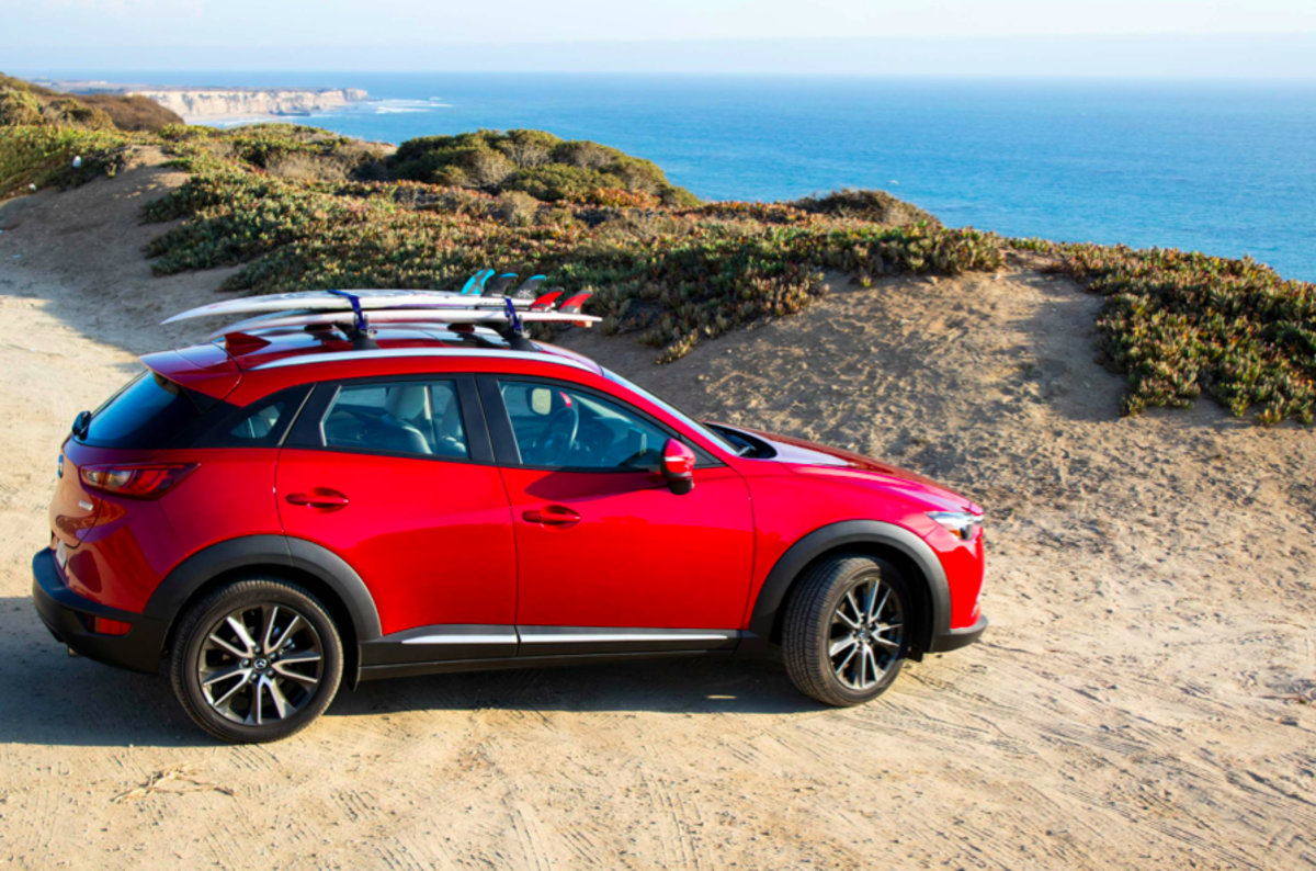 The new Mazda CX3 — the cherry chariot for the San Francisco to Santa Cruz road trip — waits for the boys to wrap up a surf check along Highway 1.