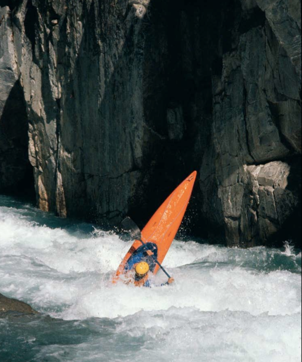 After their historic four-day descent of the Middle Fork Kings, the team faced 10 more miles of formidable whitewater. Neusome Holmes on the Garlic Falls section of Kings Canyon. August 1982.