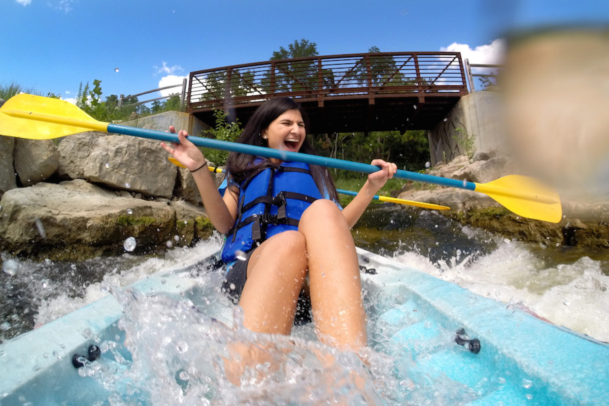 Rawan Awad reacts to almost flipping their kayak as she and Dan Masserant go through the man-made cascades on Huron River near Argo Pond in downtown Ann Arbor on a sunny July afternoon. Thursday, July 24th, 2014. Photo by Marcin Szczepansk/Senior Multimedia Producer, University of Michigan, College of Engineering