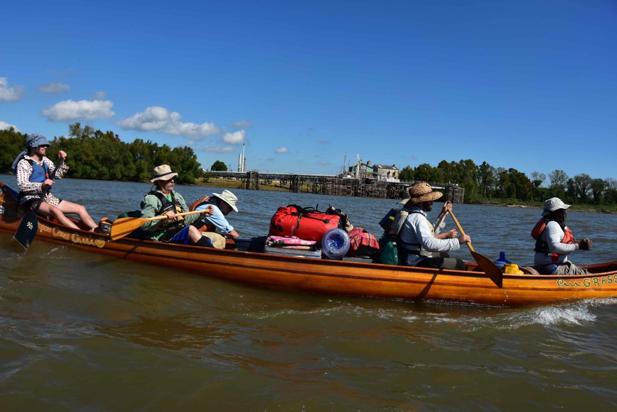 The "Why Paddle the Mississippi," crew cruising toward the Gulf of Mexico in their voyageur canoe. Photo John Ruskey