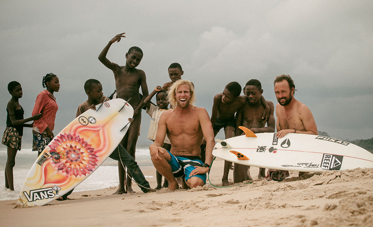 Dane Gudauskas and Kepa Acero making friends in Gabon. Photo: Courtesy of Grant Ellis/SURFER