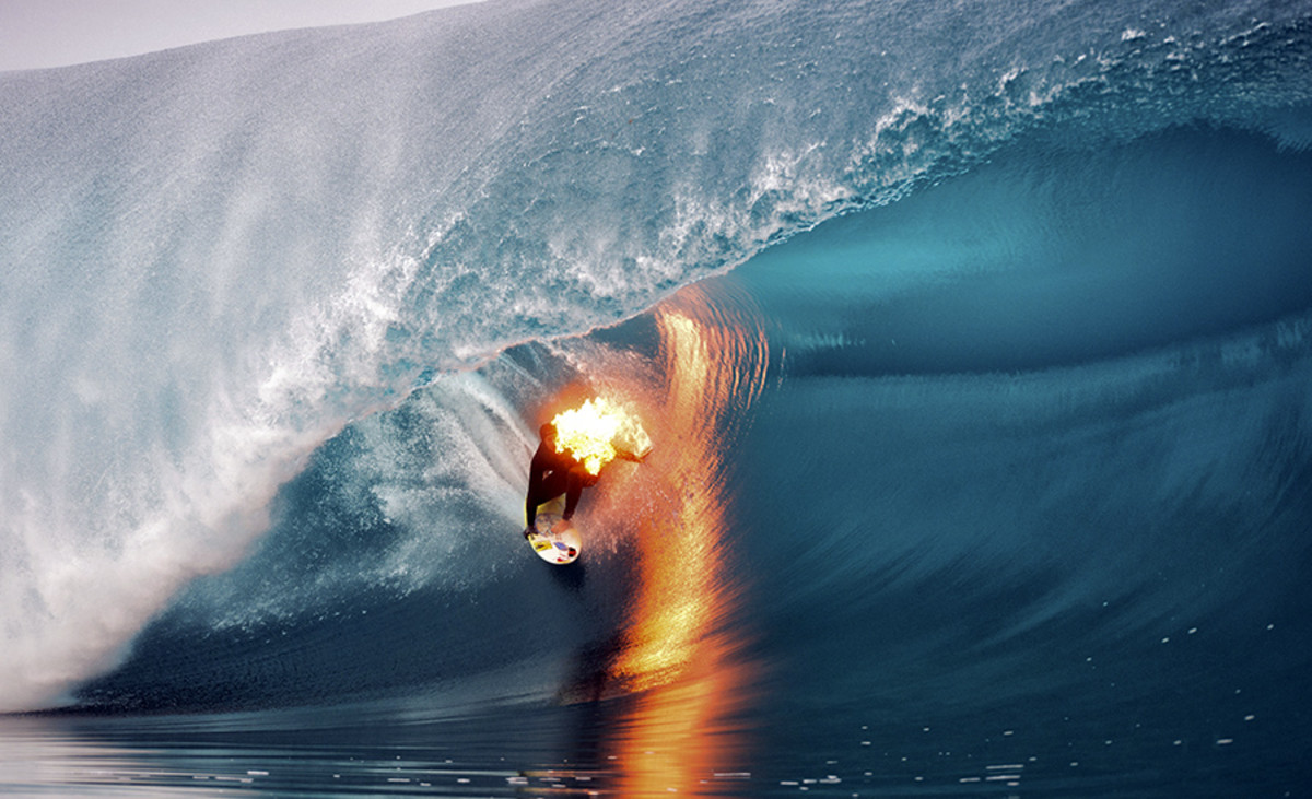 Jamie O'Brien tackles Teahupoo (while on fire). Photo: Courtesy Tim McKenna/Red Bull Content Pool