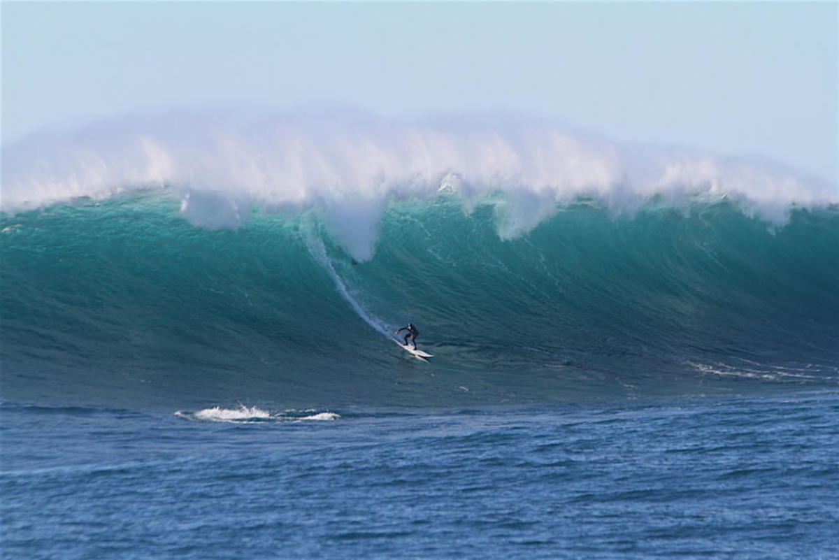 Long surfing giant waves at Todos Santos, Mexico. Photo by WSL