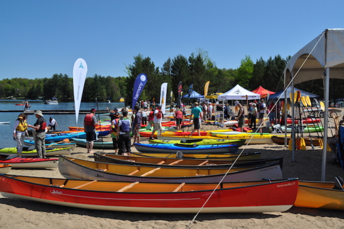 Boats line the beach at Paddlesfest, awaiting test paddlers.