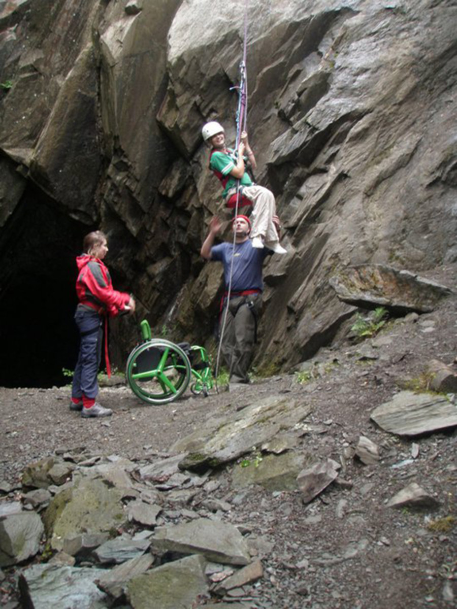 Laura May rocking climbing with a specialized chest harness. Photo: Courtesy of May