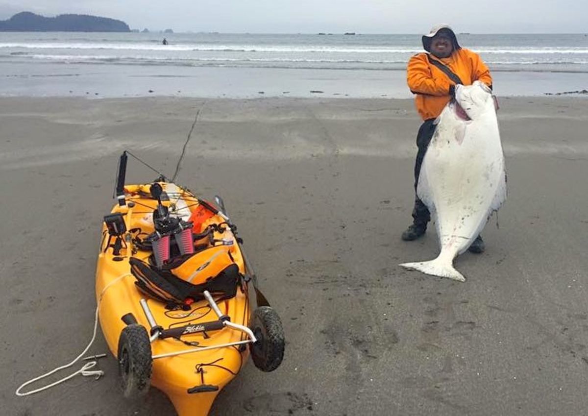 Kayak fisherman Leo Vergara stands next to his kayak to give perspective.