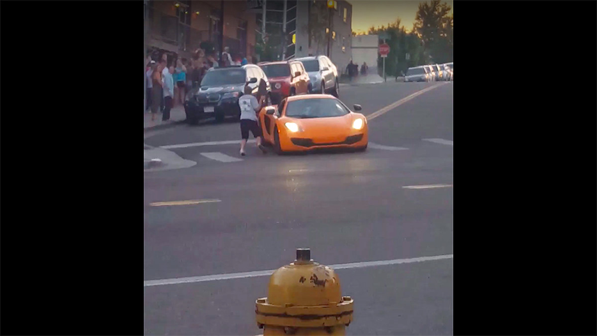Skateboarder hits McLaren after nearly getting hit