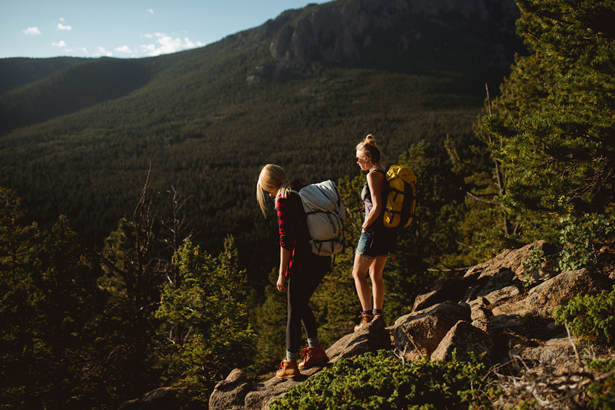 Johnie Gall and Hilary Oliver (right) hike to the top of Lily Mountain in Estes Park, Colorado. Photo: Amber L tk Photography