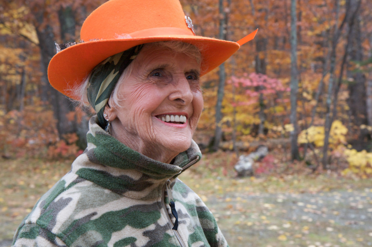 Muriel Fortier, also known as Mother Nature, in 2008 at her camp along the East Branch of the Penobscot River. She and her late husband, Frank, built the cabin themselves on land leased to them by paper companies. In 2003, the property was purchased by Roxanne Quimby as part of her efforts to conserve wilderness and preserve open space. This photograph was taken in 2008 during Mother Nature's last fall at the camp; her family's lease expired in June 2009. She died three years later, aged 96. Jennifer Leahy / @jmleahy on IG
