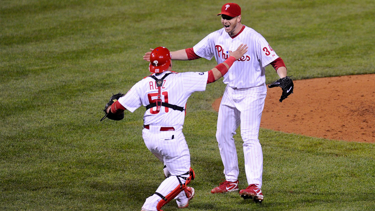Roy Halladay #34 of the Philadelphia Phillies celebrates with Carlos Ruiz #51 after throwing a no hitter against the Cincinnati Reds on October 6, 2010 during Game 1 of the NLDS at Citizens Bank Park in Philadelphia, Pennsylvania. The Phillies defeated the Reds 4-0. (Photo by: Rob Tringali/SportsChrome/Getty Images)