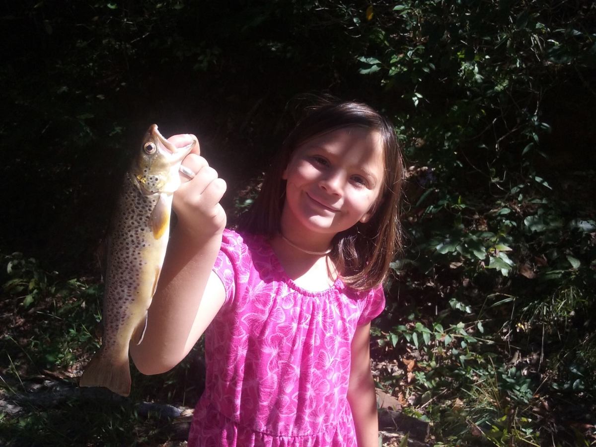Haden Rhea Serres, 7, shows off her prize while fishing with her dad, Jason Serres, in a western North Carolina creek. Photo: Courtesy of Jason Serres