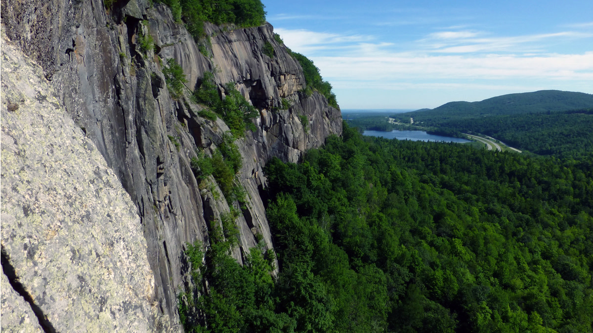 The view of Lincoln Lake from midway up Poke-O-Moonshine. Photo by Chris Van Leuven
