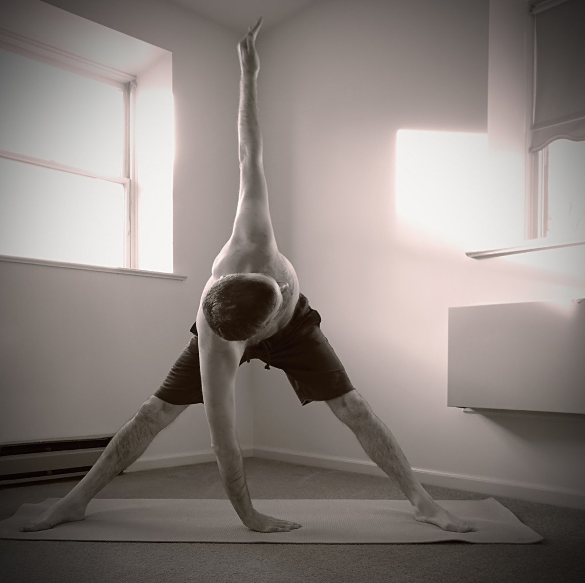The variation of the triangle pose (trikonasana) offers a good twist, similar to the core rotation in most sports. Photo: Courtesy of Nicholas Tonelli