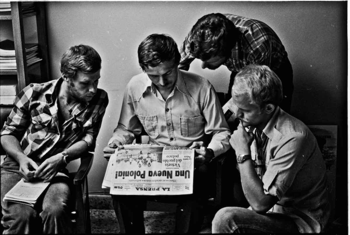 The Canoandes learn of Solidarity's victory in the Gdansk Shipyard Strike from a Panamanian Newspaper, September 10, 1980. Photo by Zbigniew Bzdak