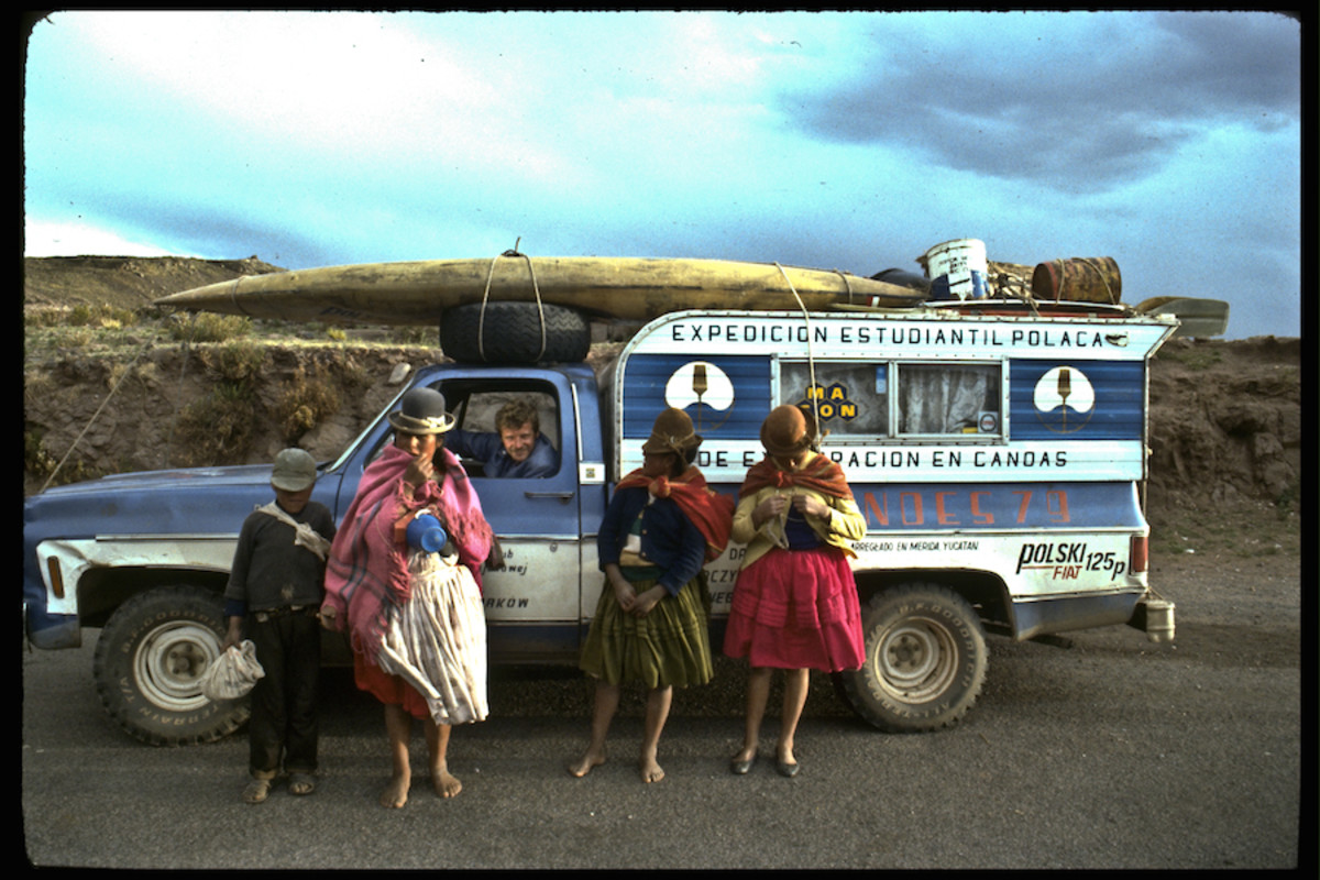 Piotr Chmielinski, at the wheel of 'Condorito,' greets local people near the Apurimac River, Peru, 1980. Photo by Zbigniew Bzdak