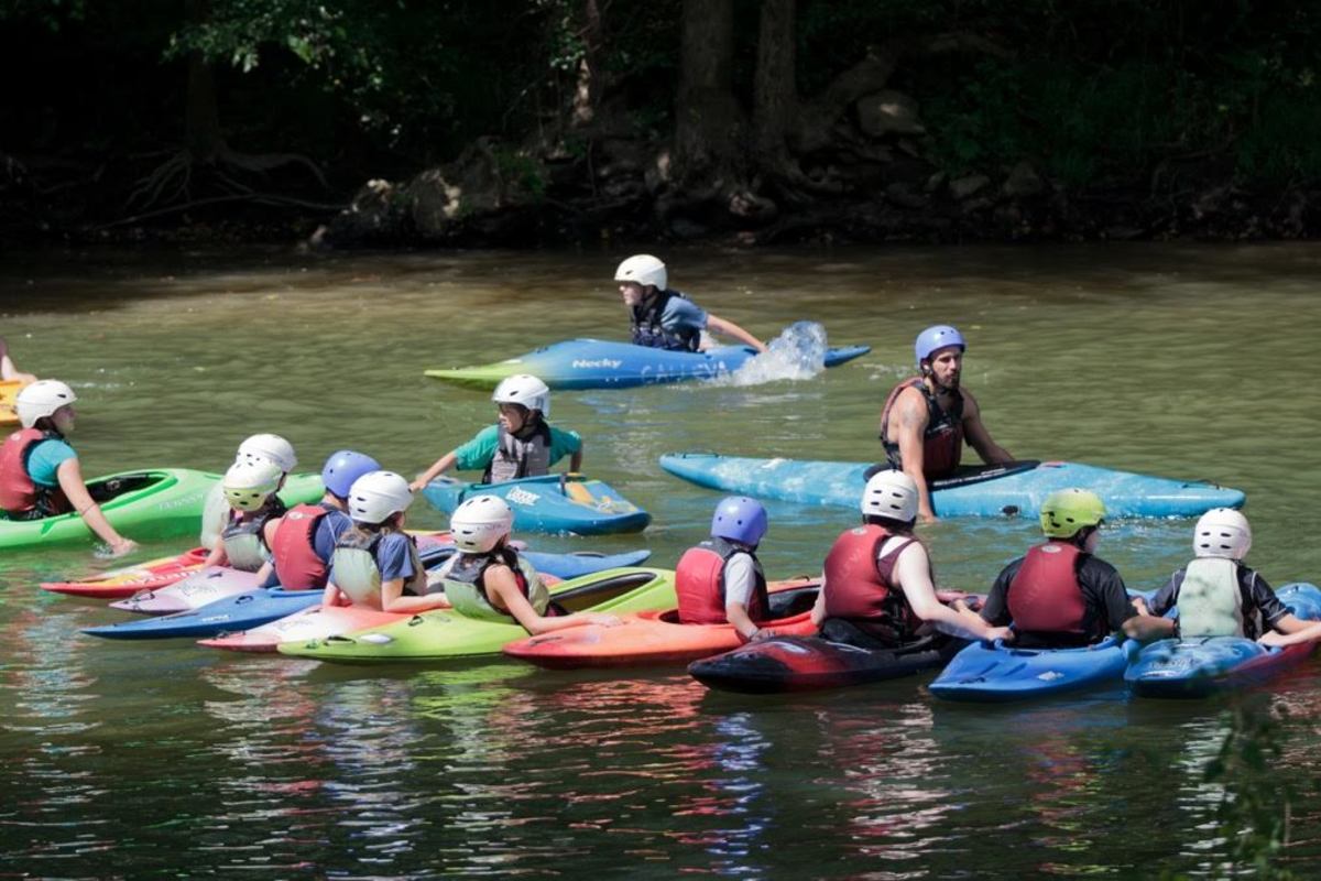 Steve McKone instructing a group on the Potomac. Image courtesy of Calleva's Liquid Adventures Kayak School