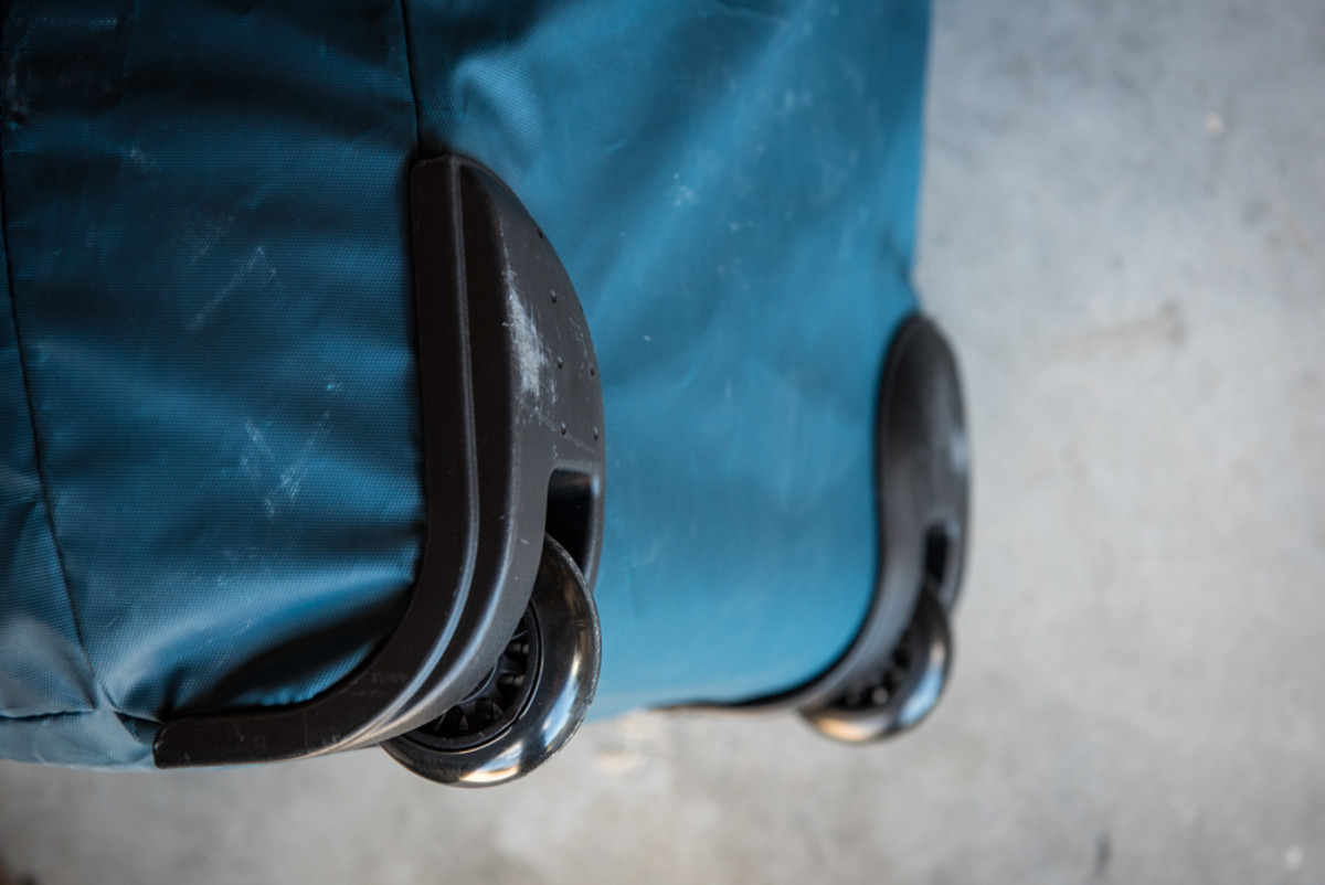 Small wheels, it'll roll in a pinch but we find it works better as a backpack or shoulder-slung duffle.