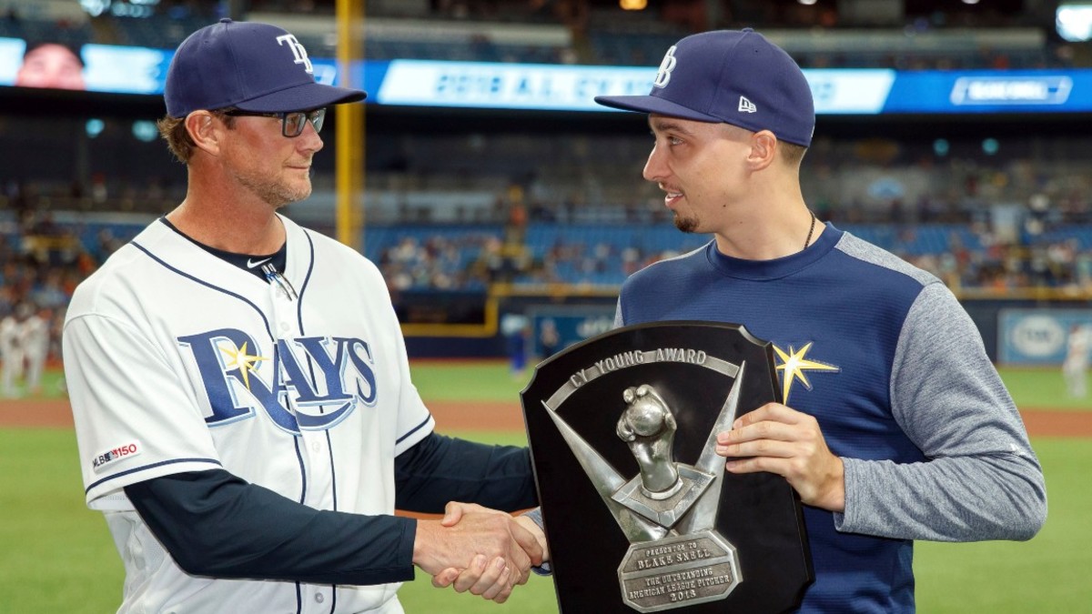 Astros Rays Baseball, St. Petersburg, USA - 30 Mar 2019 Tampa Bay Rays pitcher Blake Snell, right, receives the 2018 Cy Young Award from pitching coach Kyle Snyder prior to a baseball game against the Houston Astros, in St. Petersburg, Fla 30 Mar 2019 Image ID: 10182629b Featured in: Astros Rays Baseball, St. Petersburg, USA - 30 Mar 2019 Photo Credit: Mike Carlson/AP/Shutterstock