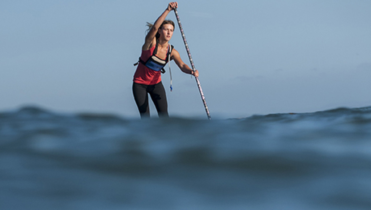 Shae Foudy standup paddleboarding off the Southern California coast.