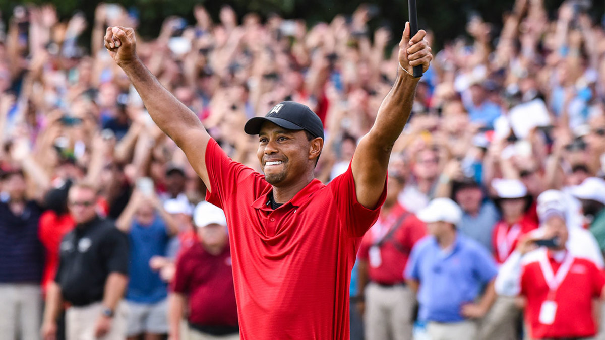 Tiger Woods celebrates his two stroke victory on the 18th hole green during the final round of the TOUR Championship after coming back from his famous athlete injury. (Photo by Keyur Khamar/PGA TOUR)