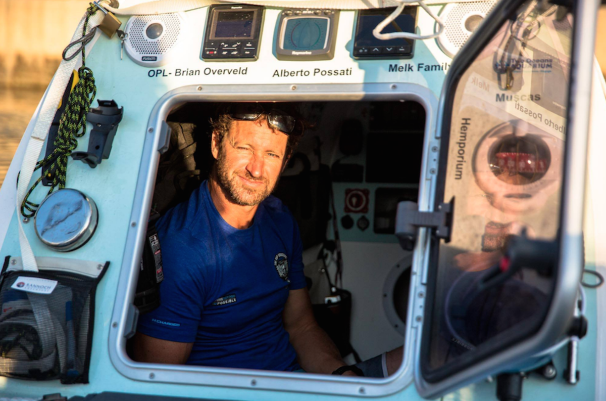 Chris Bertish in his home on the water. This is where he sleeps. Photo: #TheSUPCrossing