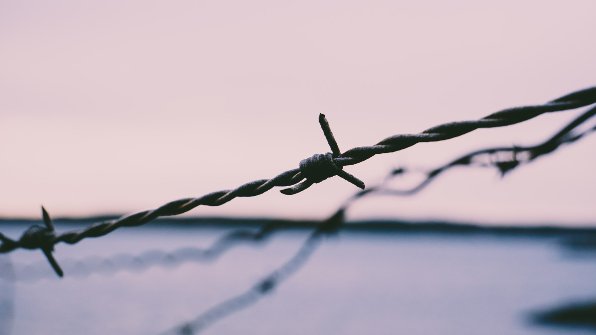 stringing barbed wire