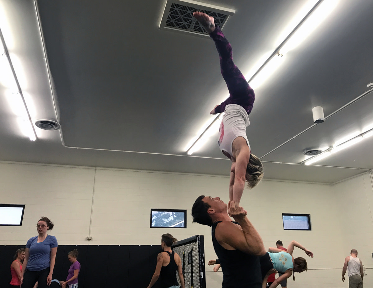 Ryane Duffey completing an inverted pose during a jam.