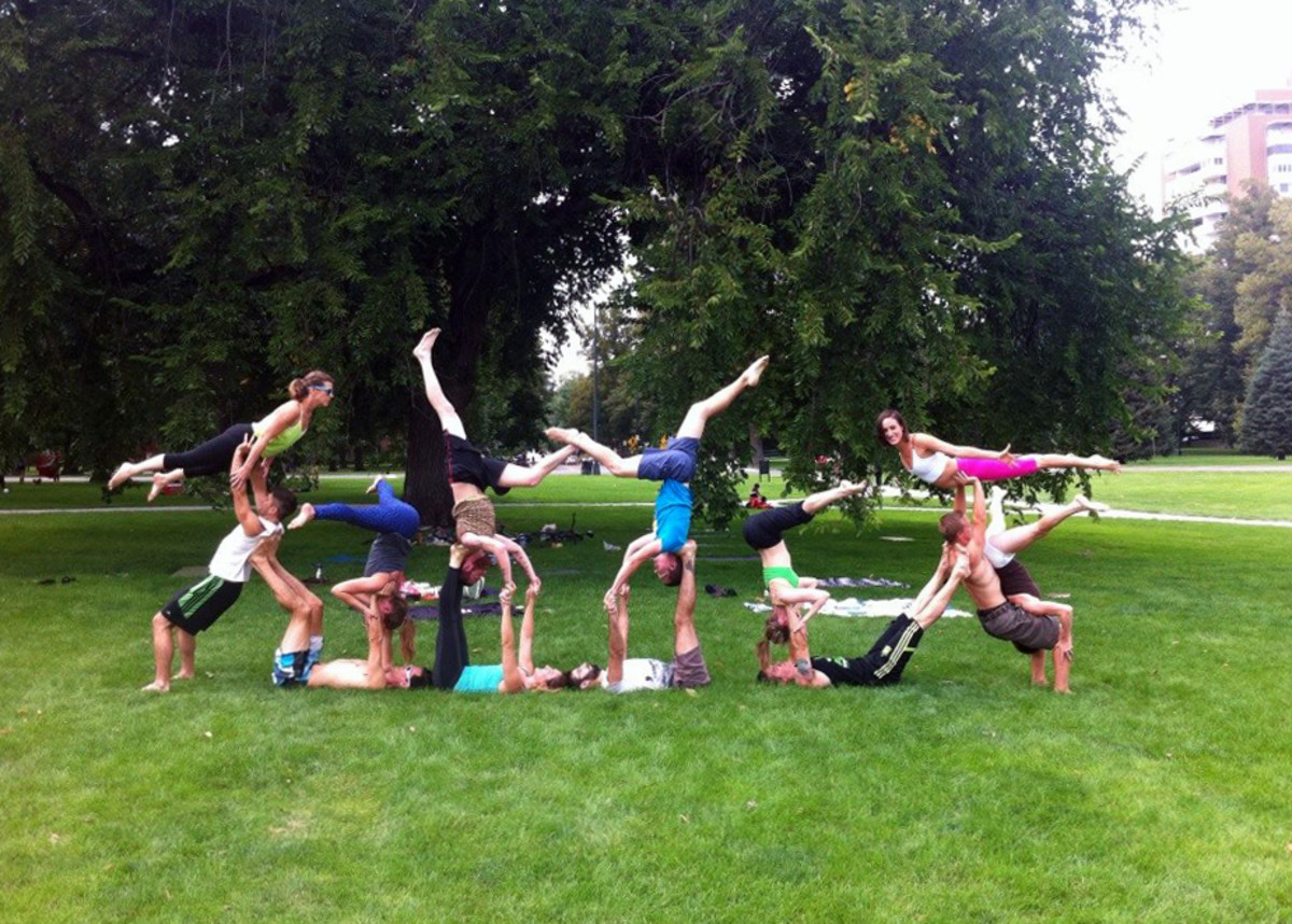 Group AcroYoga pose during a jam at Cheesman Park, Denver.