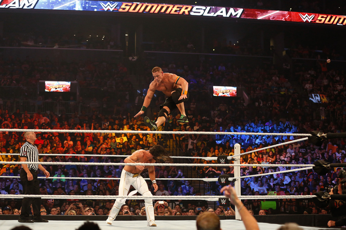 NEW YORK, NY - AUGUST 23: Seth Rollins and John Cena battle it out at the WWE SummerSlam 2015 at Barclays Center of Brooklyn on August 23, 2015 in New York City.