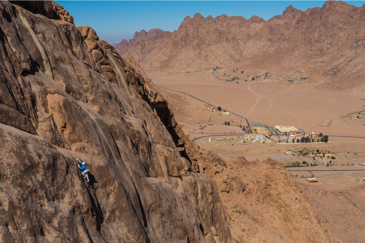 Micah-Rush-climbing-high-above-town-of-St-Catherine